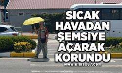 Sıcak havadan şemsiye açarak korundu