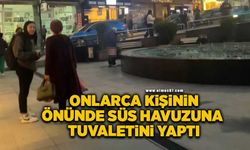 Sokak ortasındaki süs havuzuna tuvaletini yaptı