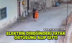 Elektrik direğindeki yatak örtüsünü alıp gitti