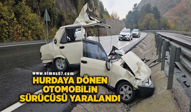 Kazada hurdaya dönen otomobilin sürücüsü hafif yaralandı