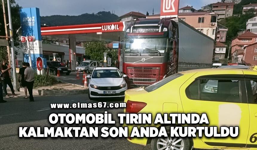 Otomobil tırın altında kalmaktan son anda kurtuldu